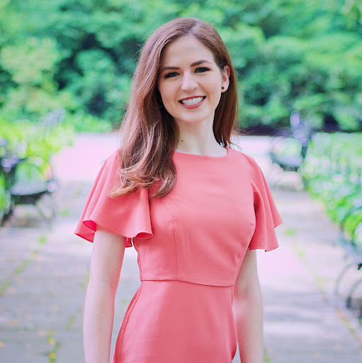 Headshot photo of Katy Brennan smiling at the camera.